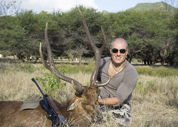 Asif Ilyasov and his trophy of Javan deer